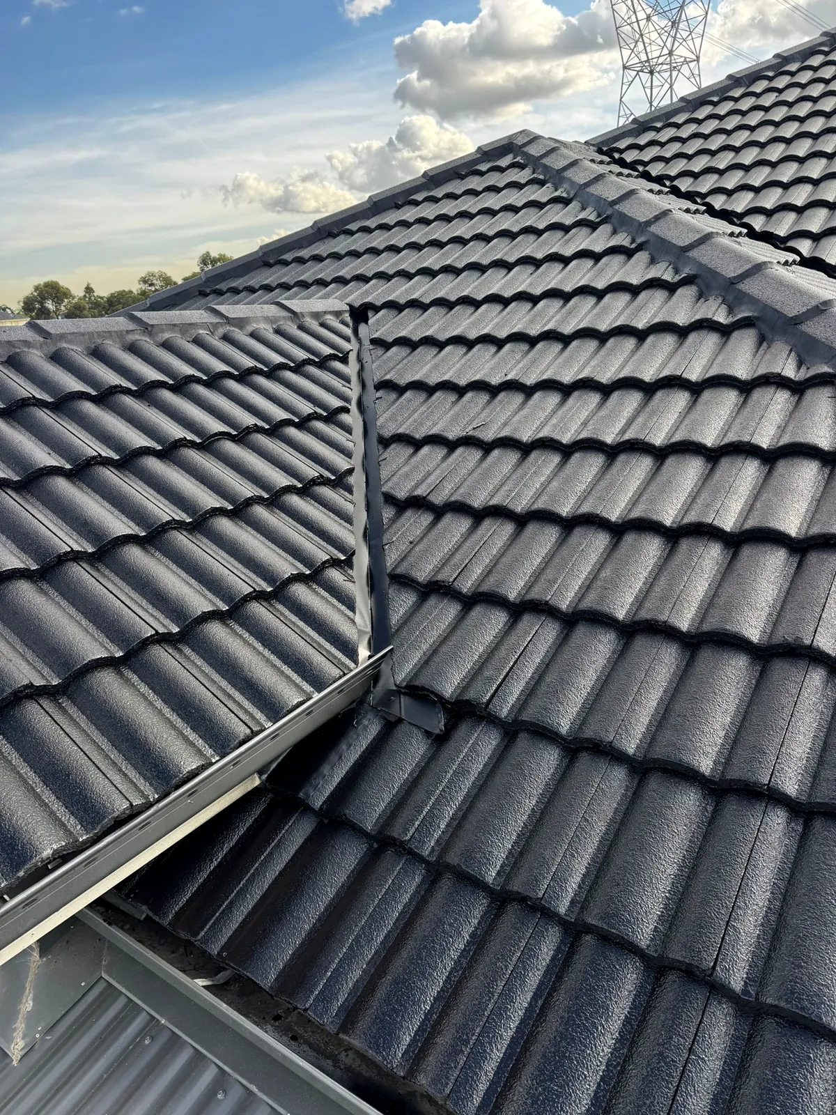 Completed dark tile roof restoration